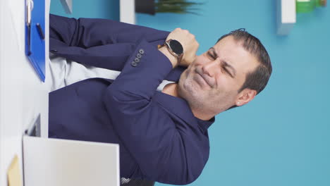 Vertical-video-of-Tired-businessman-with-aching-shoulders.
